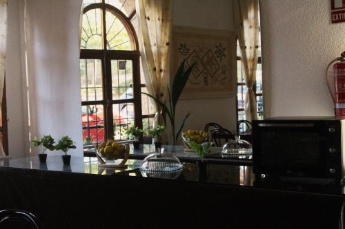 a kitchen with a counter top and a window at SunDos Feria Valencia in Valencia