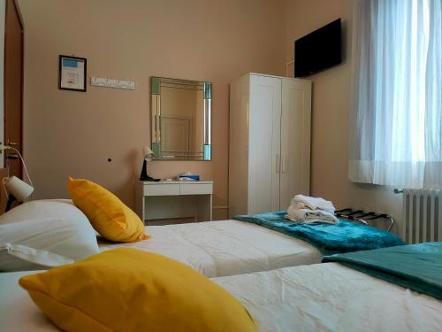 Ένα ή περισσότερα κρεβάτια σε δωμάτιο στο Hotel Il Boschetto