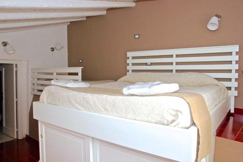 Ένα ή περισσότερα κρεβάτια σε δωμάτιο στο Agriturismo Roccadia