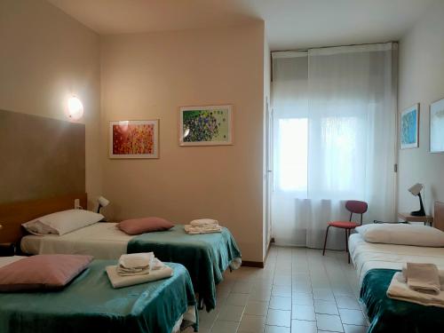 Ένα ή περισσότερα κρεβάτια σε δωμάτιο στο Hotel Il Boschetto