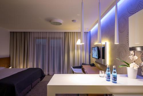 a hotel room with a bed and a table at Invite in Wrocław