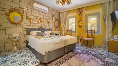 a bedroom with a large bed in a room at Lamur Hotel in Alaçatı