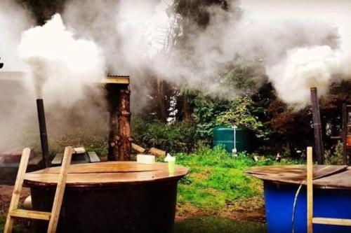 a table and chairs with smoke coming out of it at Camp Hillcrest, flat, in Gloucestershire