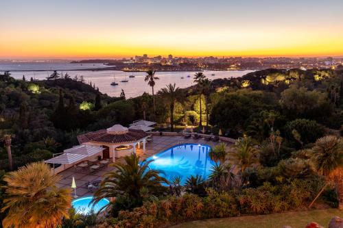 an aerial view of a villa with a swimming pool at Hotel Casabela in Ferragudo