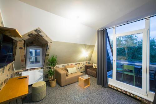TV a/nebo společenská místnost v ubytování aappartel APARTHOTEL Herford
