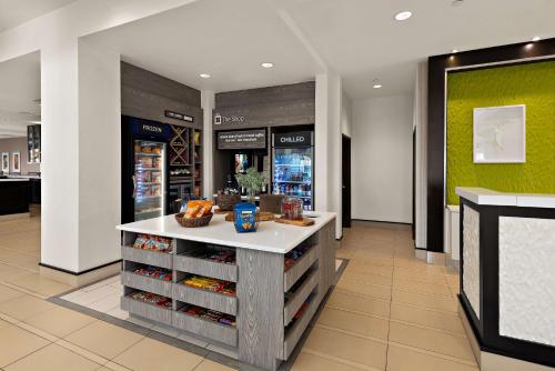 a grocery store with a counter in the middle at Hilton Garden Inn Findlay in Findlay