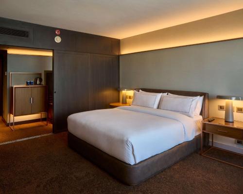 a large white bed in a hotel room at Hilton Buenos Aires in Buenos Aires