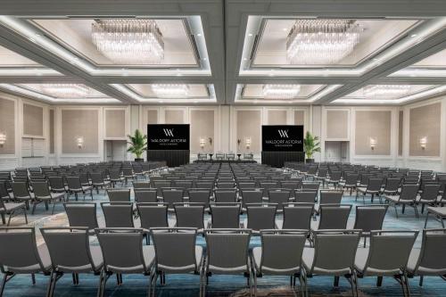 an empty room with rows of chairs in a hall at Signia by Hilton Orlando - An Official Walt Disney World Hotel in Orlando