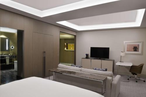 a hotel room with a bed and a television at Hilton Tanger City Center in Tangier