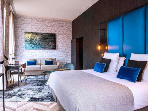 Postel nebo postele na pokoji v ubytování Mercure Figeac Viguier du Roy