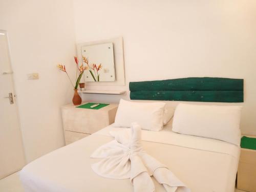 Postel nebo postele na pokoji v ubytování Cozzy White Villa