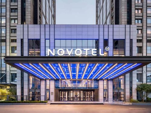 a building with a novisor sign on it at Novotel Shanghai JingAn in Shanghai