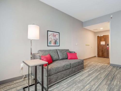 a living room with a couch and a table at Hampton Inn & Suites Cincinnati Midtown Rookwood in Cincinnati