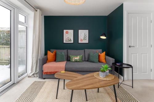 a living room with a couch and a table at Modern 2-Bed Townhouse in Kirkdale in Liverpool