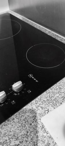 a black and white picture of a bathroom with a sink at The Captain's Lodge Looe in Looe
