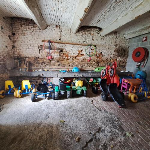 a room with a bunch of toys on the floor at Maison Berton in Gedinne
