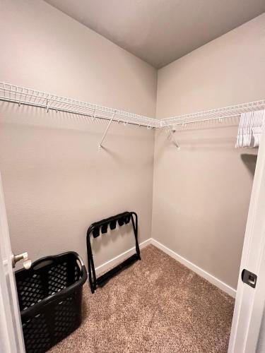 a walk in closet with a radiator in a room at Modern Style KING bed Free Wi-Fi with Garage in Spokane Valley