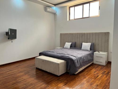 Un pat sau paturi într-o cameră la Txumas