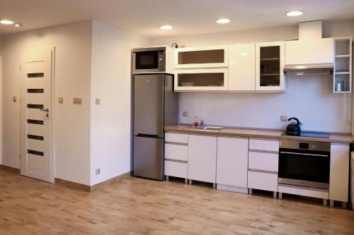 Η κουζίνα ή μικρή κουζίνα στο Apartament dla pracowników Katowice