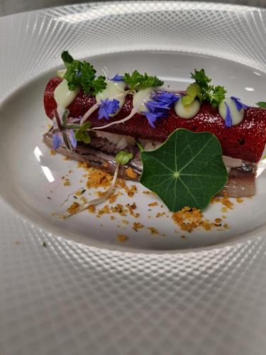 a white plate with a dessert on top of it at De Stobbe hotel & suites in Ruinen