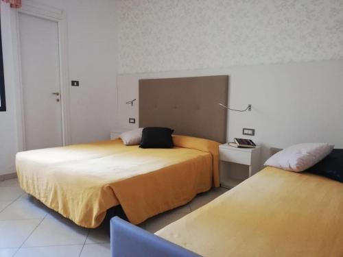 Postel nebo postele na pokoji v ubytování B&B Metropols Sottomarina