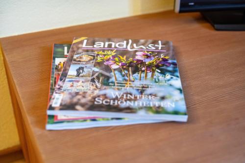 a magazine sitting on top of a table at Lechnerhof Apt 1 in Braies