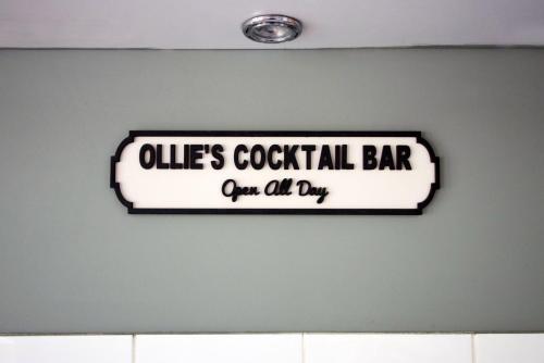 a sign for a volleyball bar on a wall at Parking | 2BR | Luxurious in Cardiff
