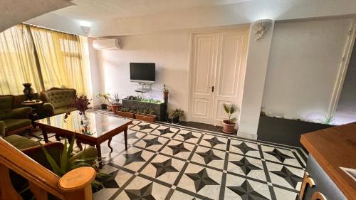 Télévision ou salle de divertissement dans l'établissement Elross Hotel