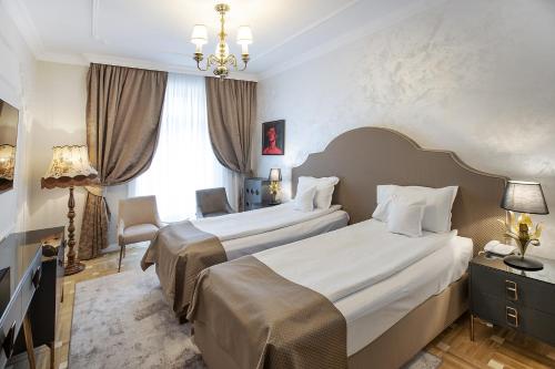 Кровать или кровати в номере Hotel Palace