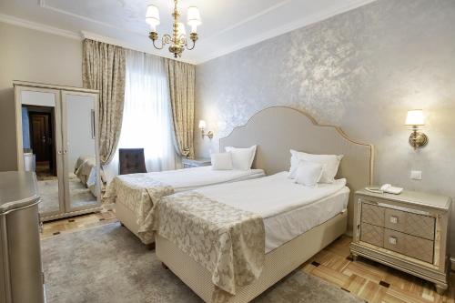Кровать или кровати в номере Hotel Palace