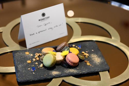 a plate of pastries sitting on top of a chair at Monastery Boutique Hotel Budapest in Budapest
