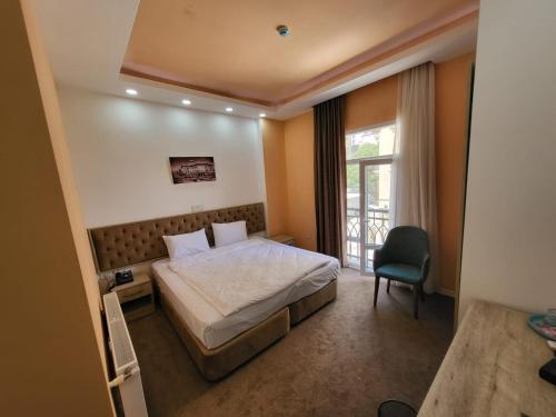 Кровать или кровати в номере Venera Hotel