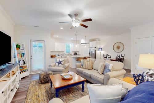 a living room with a couch and a table at The Gough Coast in Beaufort