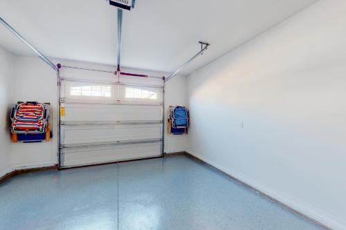 a garage with two garage doors and a room with at The Gough Coast in Beaufort