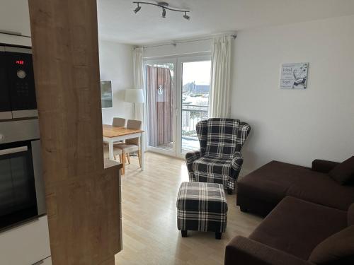 Гостиная зона в Moderne Ferienwohnung an der Ostsee im Haus Leuchtfeuer