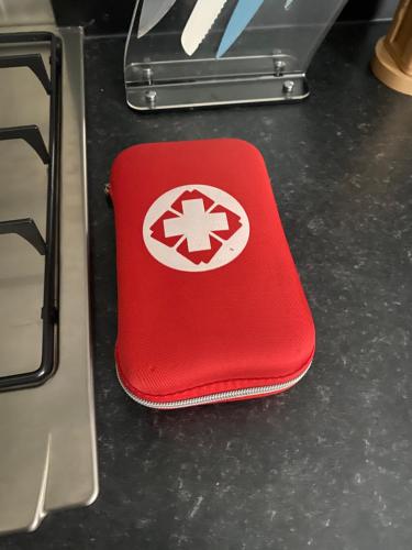 a red case with a star on it sitting on a table at Villa des Grenadelles in Saint-Paul