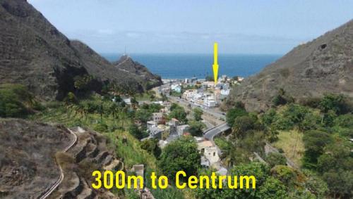 a view of a town on a mountain with the ocean at Pousada do Ceu in Paul