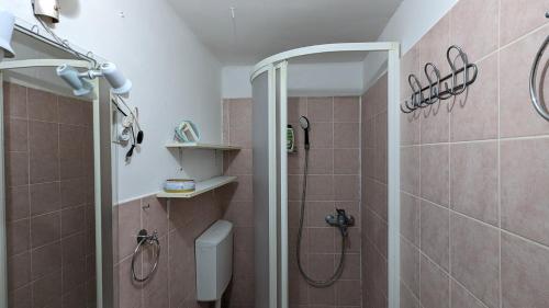 a bathroom with a shower and a toilet at Apartment in the historical city center with amazing seaviews Peter Pan in Poreč in Poreč