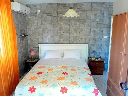 Postel nebo postele na pokoji v ubytování IOLI Apartment