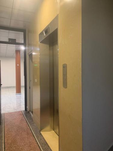 an elevator in an office building with its door open at Hotel Thuý đông in Sóc Sơn