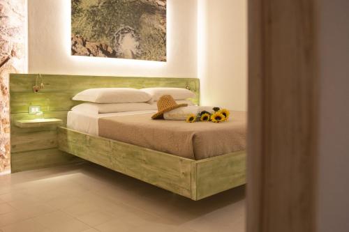 a bedroom with a bed with two stuffed animals on it at PORTA SOPRANA luxury guest House & spa in Sclafani