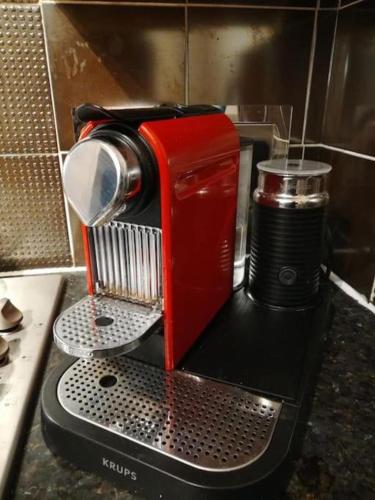 a red coffee maker sitting on top of a counter at Fisherman's Terrace (Tardis) On Quay/Free Parking in Poole