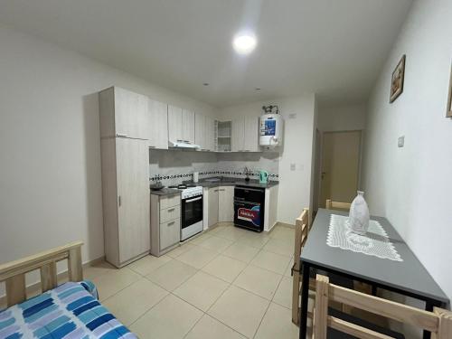 a kitchen and dining room with a table and a dining room at Edificio Misionero Klein in Resistencia