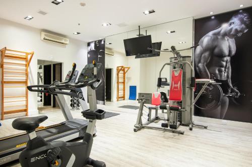 a gym with cardio equipment in a room at Principado Downtown in Buenos Aires
