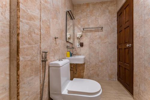 a bathroom with a toilet and a sink at Maamadi Boutique in Maafushi