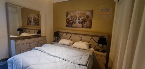 מיטה או מיטות בחדר ב-B.G luxury apartment near Air Mall