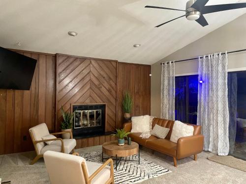 a living room with a couch and a fireplace at Charming Condo Near WFU and Hospitals, Full Kitchen, Strong WiFi, In-Unit Laundry in Winston-Salem