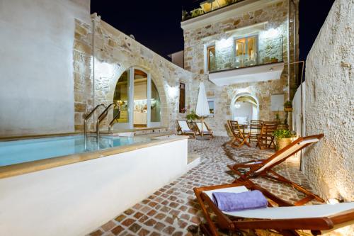a villa with a swimming pool and a patio at Villa Nicola in Kissamos