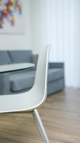 a white chair in a room with a desk at Palazzo Gilberto in Padova