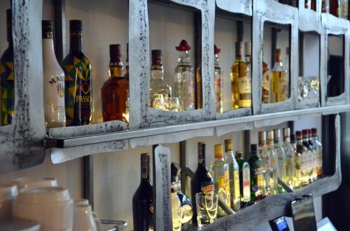 a shelf filled with lots of bottles of alcohol at Solidaris in Kędzierzyn-Koźle
